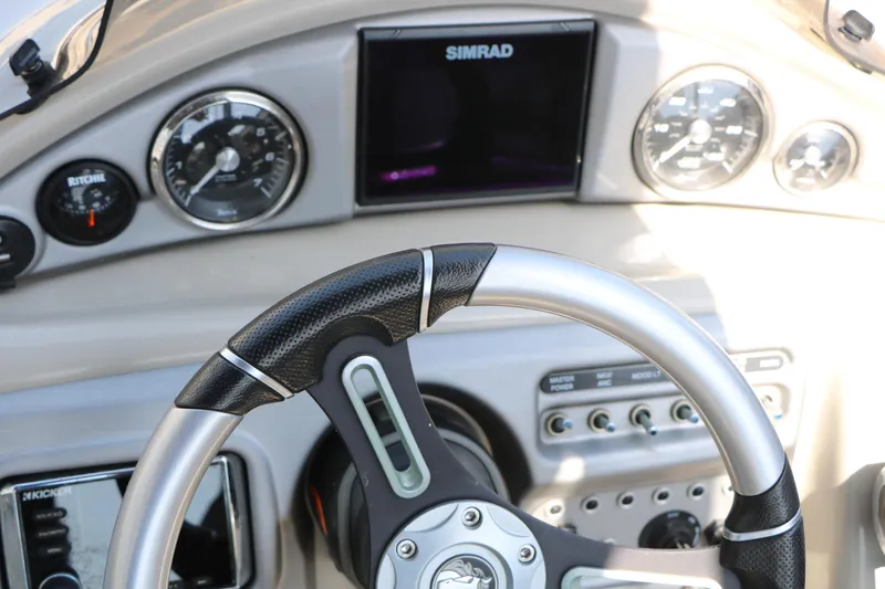 Slide: The Image of Steering wheel and dashboard of 2019 Trifecta 23RF SS Arch boat. - 34
