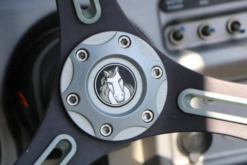 Slide: The Image of Steering wheel of 2019 Trifecta 23RF SS Arch with horse emblem. - 49