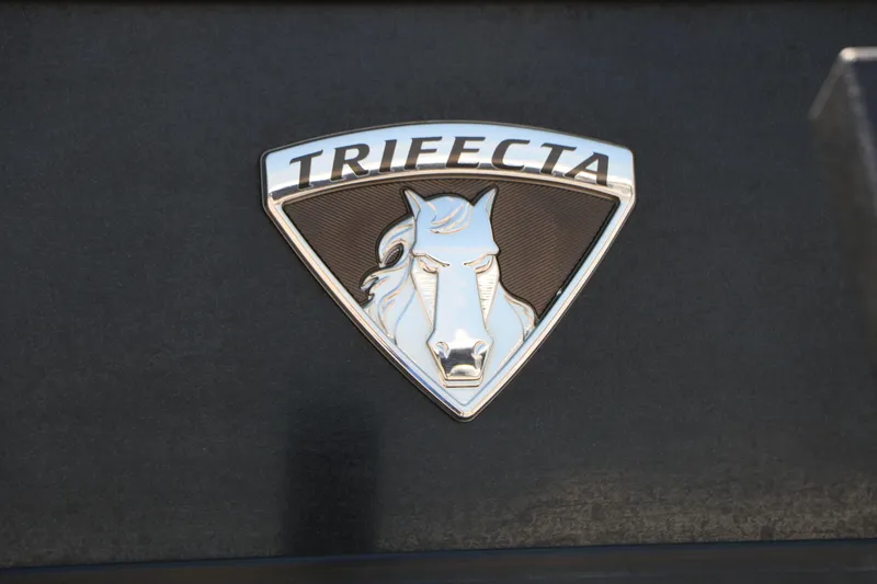 Slide: The Image of Trifecta 23RF SS Arch 2019 emblem featuring a stylized horse logo on a dark background. - 5
