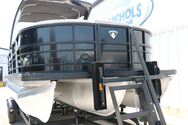 Slide: The Image of 2019 Trifecta 23RF SS Arch pontoon boat on trailer, black exterior, side view. - 3