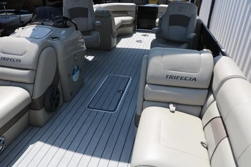 Slide: The Image of 2019 Trifecta 23RF SS Arch pontoon boat interior with beige seating and sleek design. - 19