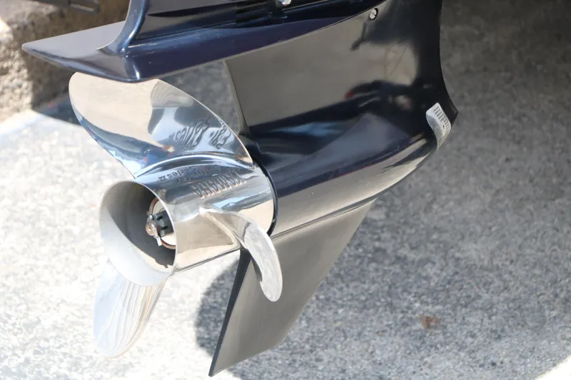 Slide: The Image of Close-up of a 2019 Trifecta 23RF SS Arch boat propeller on a concrete surface. - 8