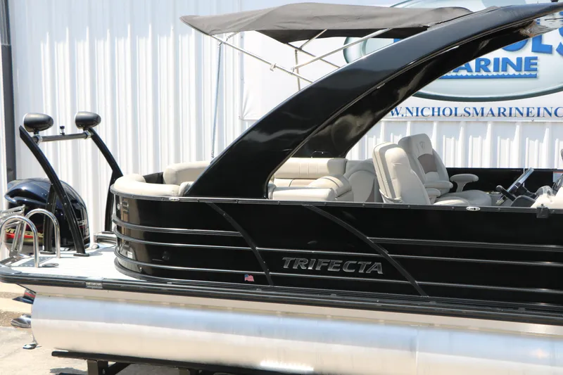 Slide: The Image of 2019 Trifecta 23RF SS Arch pontoon boat with sleek black design and comfortable seating. - 14
