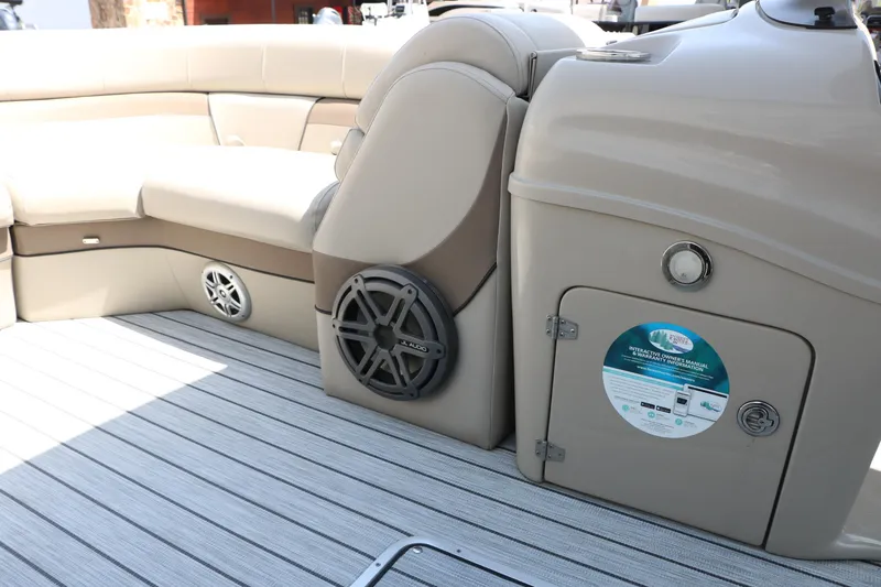 Slide: The Image of 2019 Trifecta 23RF SS Arch boat interior with beige seating and JL Audio speakers. - 36