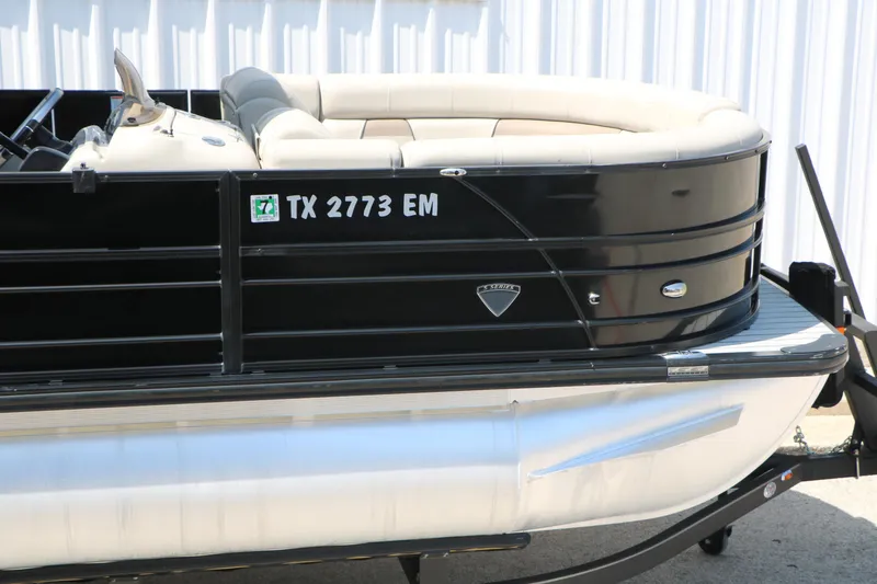 Slide: The Image of 2019 Trifecta 23RF SS Arch pontoon boat with black exterior and beige seating. - 12