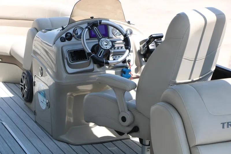 Slide: The Image of 2019 Trifecta 23RF SS Arch boat helm with steering wheel and control panel. - 27