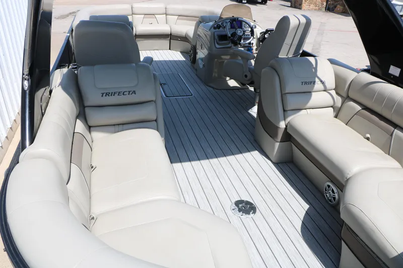 Slide: The Image of Luxurious 2019 Trifecta 23RF SS Arch pontoon boat interior with plush seating and modern helm. - 24