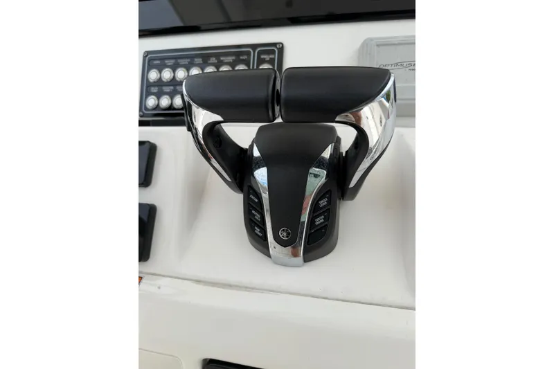 Slide: The Image of Throttle controls on a 2022 Sea Fox 288 Commander boat dashboard. - 14