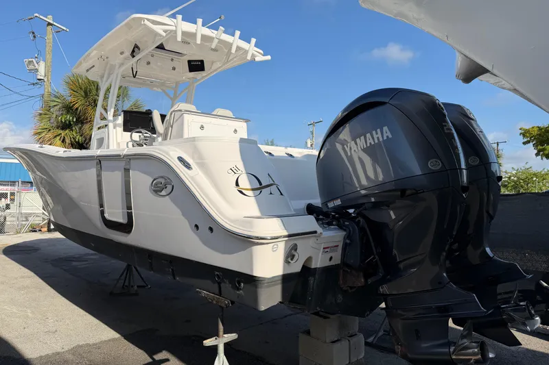 Slide: The Image of 2022 Sea Fox 288 Commander boat with Yamaha engines, docked outdoors. - 51