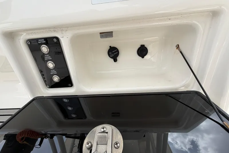 Slide: The Image of Control panel of 2022 Sea Fox 288 Commander boat, featuring battery switches and outlets. - 23