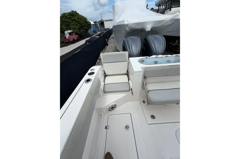 Slide: The Image of 2022 Sea Fox 288 Commander boat interior with seating and dual engines. - 42