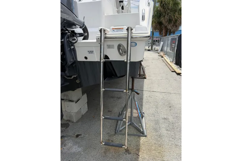 Slide: The Image of 2022 Sea Fox 288 Commander boat ladder on a stand, outdoor setting. - 11