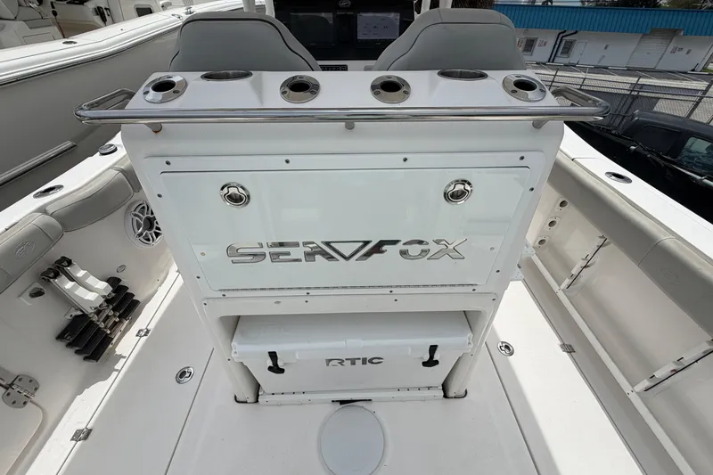 Slide: The Image of 2022 Sea Fox 288 Commander boat interior with rod holders and storage compartments. - 27