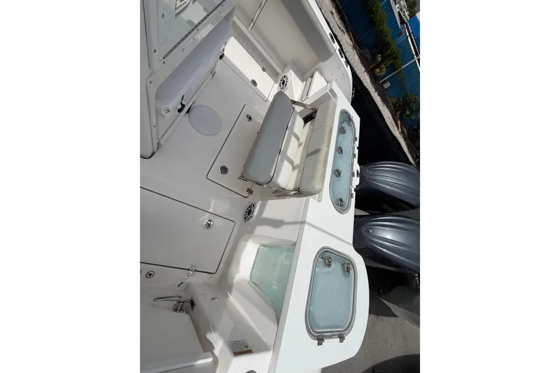 Slide: The Image of 2022 Sea Fox 288 Commander boat deck with seating and storage compartments. - 33
