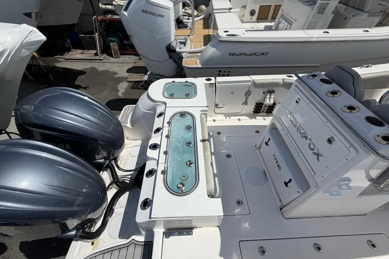 Slide: The Image of 2022 Sea Fox 288 Commander boat with dual Yamaha engines and fishing amenities. - 47