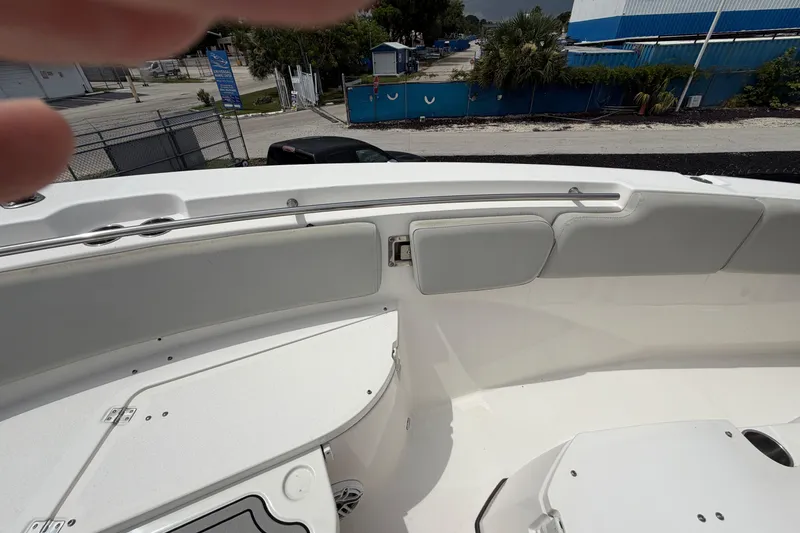 Slide: The Image of 2022 Sea Fox 288 Commander boat interior with white seating and storage compartments. - 37