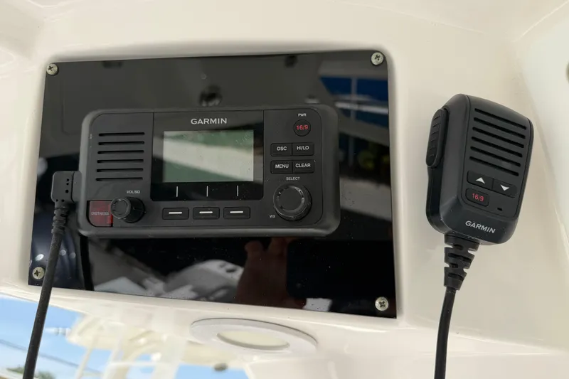 Slide: The Image of Garmin marine radio system on 2022 Sea Fox 288 Commander boat dashboard. - 16