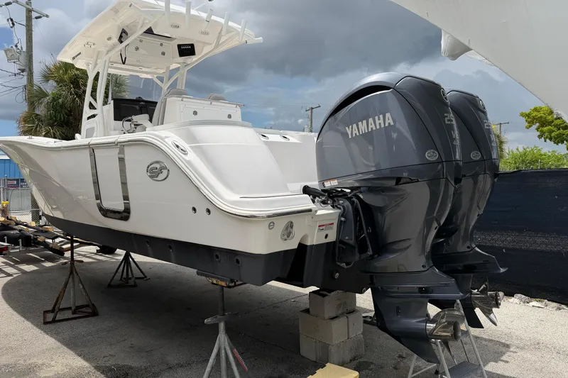 Slide: The Image of 2022 Sea Fox 288 Commander boat with twin Yamaha engines on display. - 1