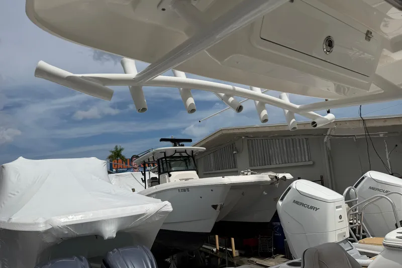 Slide: The Image of 2022 Sea Fox 288 Commander boat with Mercury engines in a marina setting. - 18