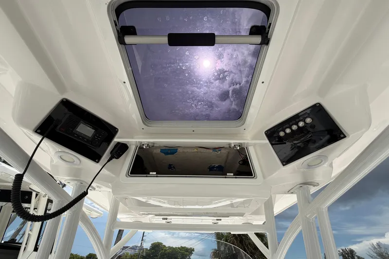 Slide: The Image of Interior view of 2022 Sea Fox 288 Commander boat's control panel and skylight. - 20