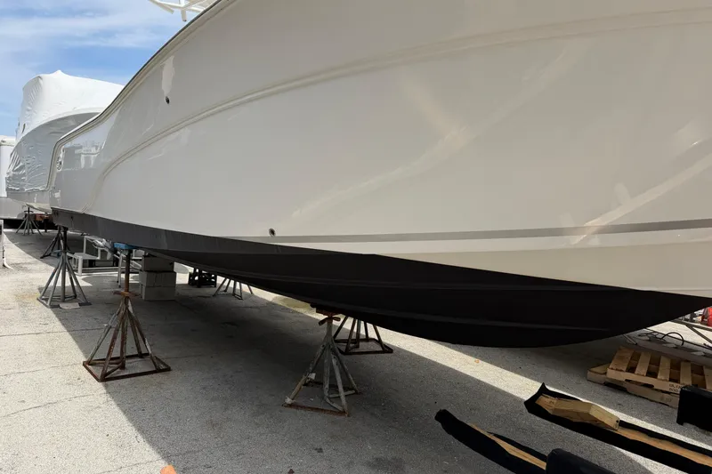 Slide: The Image of 2022 Sea Fox 288 Commander boat on stands, side view, outdoors. - 2