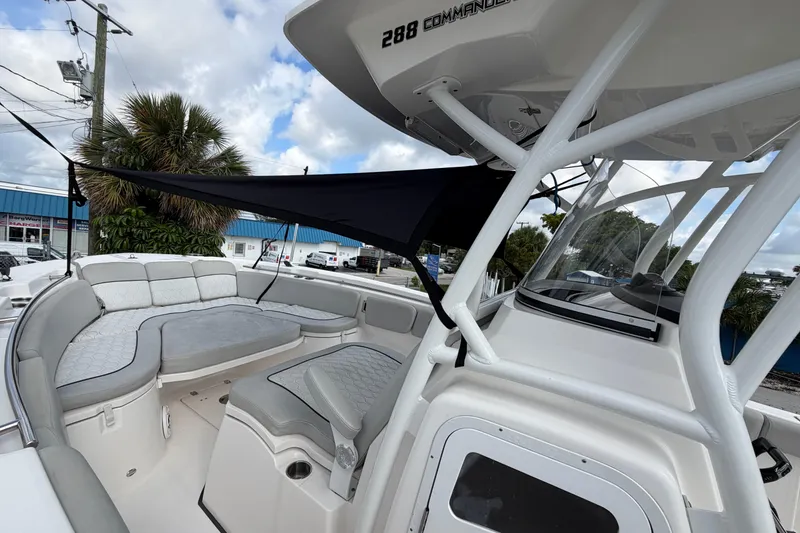 Slide: The Image of 2022 Sea Fox 288 Commander boat with spacious seating and canopy, docked outdoors. - 54