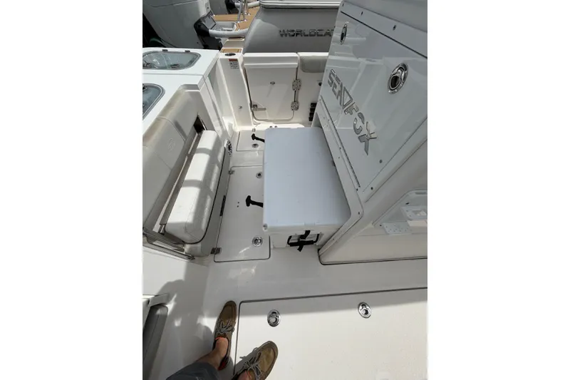 Slide: The Image of 2022 Sea Fox 288 Commander boat interior with seating and storage compartments. - 28