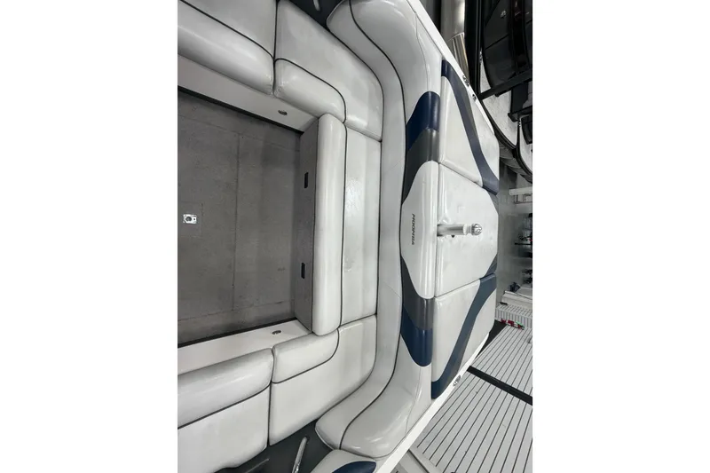 Slide: The Image of 2010 Moomba LSV boat interior with white and gray seating, showcasing sleek design. - 6