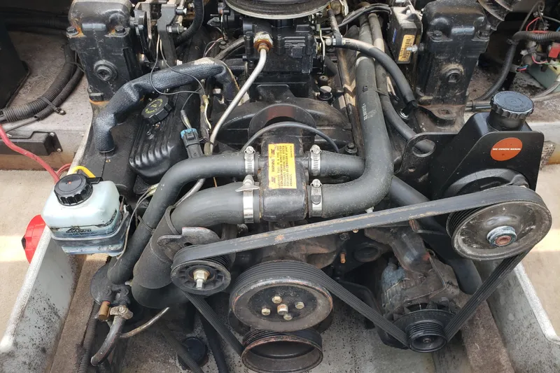 Slide: The Image of Engine of a 1998 Chaparral 2130 SS boat, showcasing belts and components. - 16