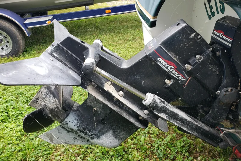 Slide: The Image of 1998 Chaparral 2130 SS boat with a MerCruiser outdrive on grass. - 5