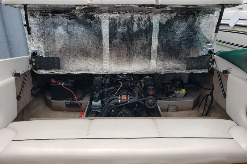 Slide: The Image of 1998 Chaparral 2130 SS boat engine compartment with exposed motor and wiring. - 21