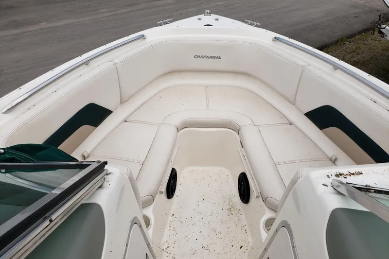 Slide: The Image of 1998 Chaparral 2130 SS boat interior with white seating and green accents. - 15