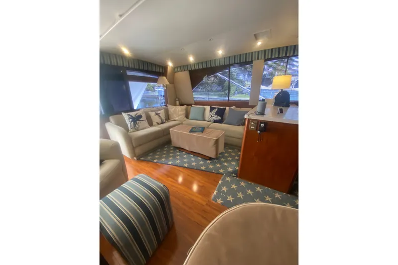 Slide: The Image of Luxurious 1996 Ocean Super Sport yacht interior with cozy seating and nautical decor. - 10