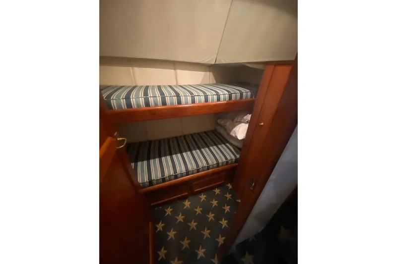 Slide: The Image of Bunk beds with striped mattresses in 1996 Ocean Super Sport yacht cabin. - 17