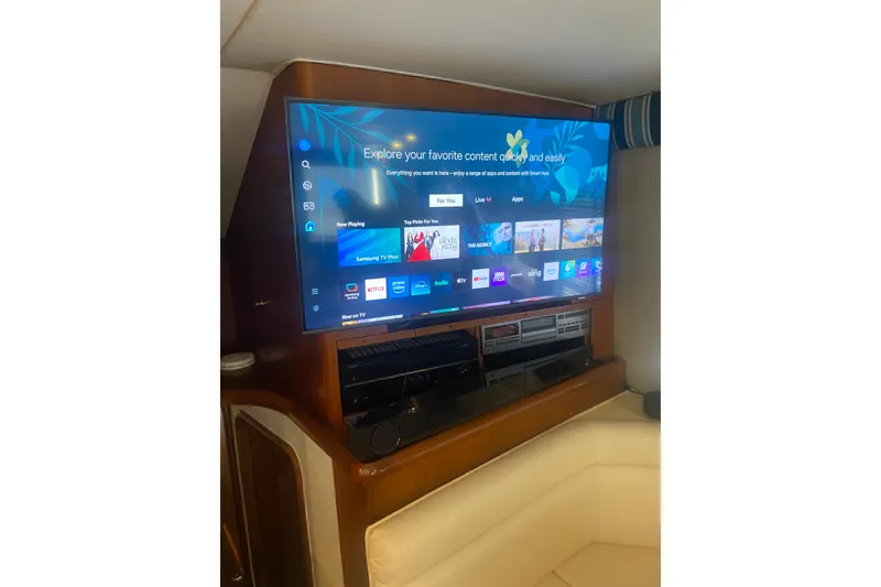 Slide: The Image of Entertainment system on a 1996 Ocean Super Sport yacht with a modern flat-screen TV. - 3