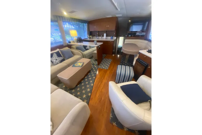Slide: The Image of Luxurious 1996 Ocean Super Sport yacht interior with elegant seating and nautical decor. - 2
