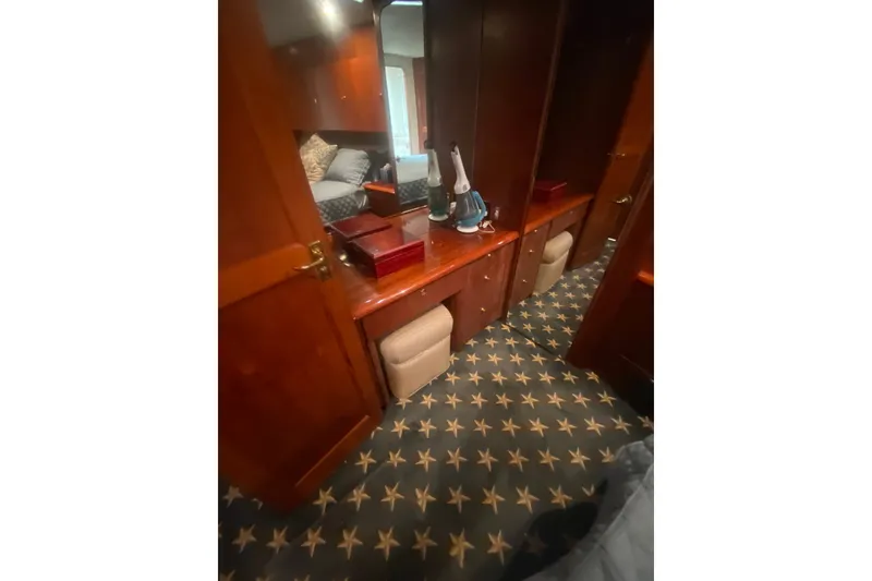 Slide: The Image of Luxurious cabin interior of 1996 Ocean Super Sport yacht with star-patterned carpet. - 12
