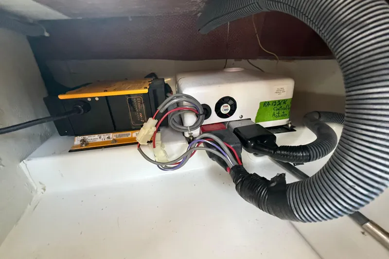 Slide: The Image of Electrical components and wiring inside a 2021 Duffy Bay Island 22 boat. - 20