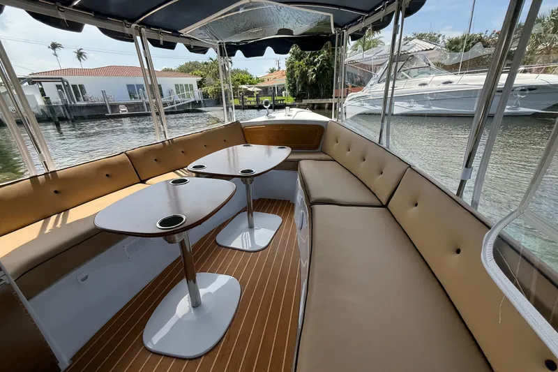 Slide: The Image of Spacious interior of 2021 Duffy Bay Island 22 boat with comfortable seating and tables. - 9