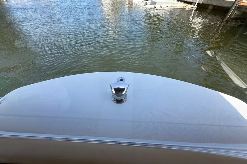 Slide: The Image of Bow view of 2021 Duffy Bay Island 22 boat on calm water. - 19