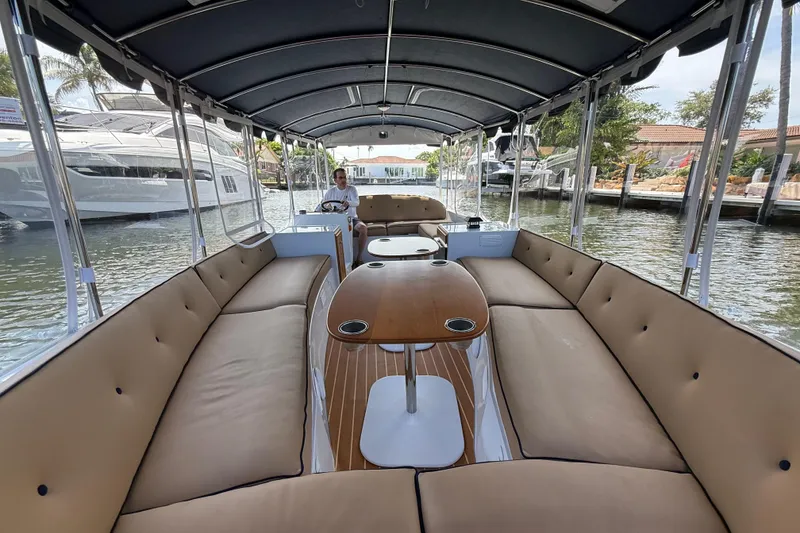 Slide: The Image of Interior view of a 2021 Duffy Bay Island 22 electric boat with spacious seating. - 12