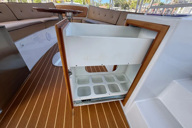 Slide: The Image of Interior of 2021 Duffy Bay Island 22 boat with open storage compartment. - 17