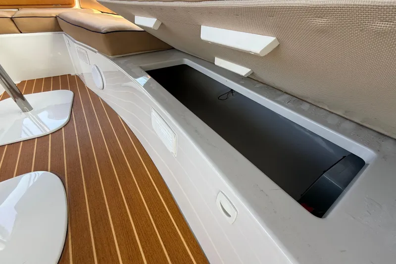 Slide: The Image of Interior storage compartment of 2021 Duffy Bay Island 22 boat with wooden flooring. - 18