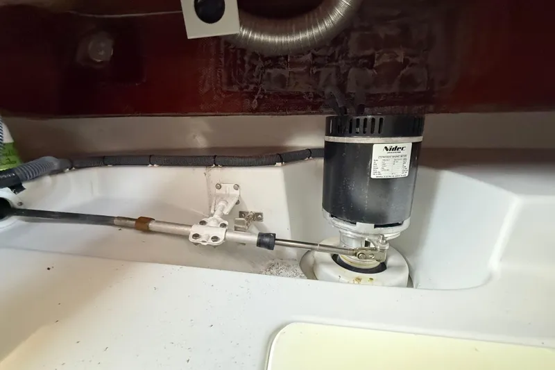 Slide: The Image of Electrical motor and steering mechanism inside a 2021 Duffy Bay Island 22 boat. - 21