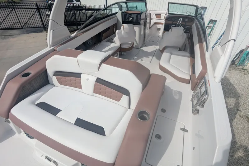 Slide: The Image of 2017 Four Winns HD240 boat interior with spacious seating and modern design. - 8
