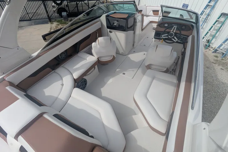 Slide: The Image of 2017 Four Winns HD240 boat interior with spacious seating and modern design. - 9