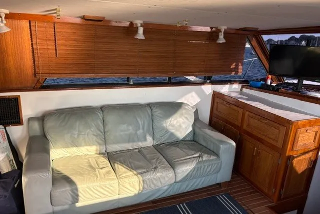 Slide: The Image of Interior of 1987 Fortier 40 boat with leather sofa and wooden cabinetry. - 10