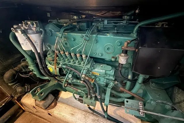 Slide: The Image of Engine of a 1987 Fortier 40 boat, showcasing intricate mechanical components. - 18