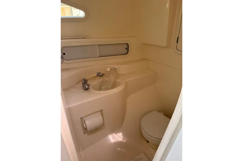Slide: The Image of Compact bathroom in 2004 Corsair 36 sailboat with sink and toilet. - 4