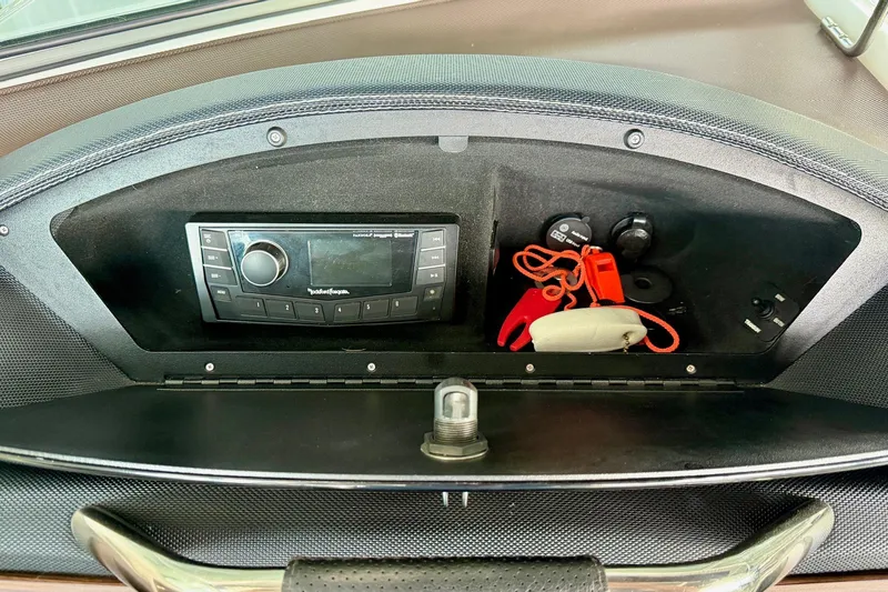 Slide: The Image of 2017 Cobalt A25 dashboard with Rockford Fosgate stereo and storage compartment. - 42